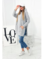 Pašiltintas megztinis su skeltukais šonuose (Pilka)